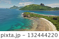 Fiji, Kuata island: Breathtaking aerial view of crystal clear turquoise water lagoon, vibrant coral reefs, wild sand beach, and lush vegetation. Green mountains under blue sky. Drone flight Fiji, Kuata island: Breathtaking aerial view of crystal clear turquoise water lagoon, vibrant coral reefs, wild sand beach, and lush vegetation. Green mountains under blue sky. Drone flight 132444220
