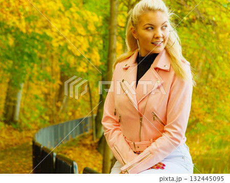 Fashion woman walking in autumn park 132445095