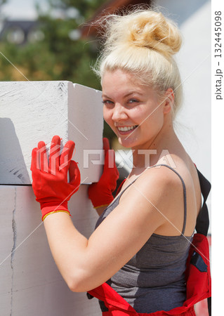 Woman working with airbricks Woman working with airbricks 132445098