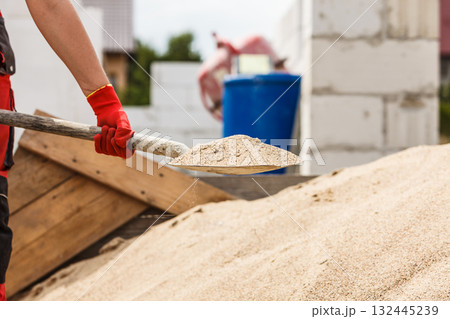 Person using shovel on construction site 132445239