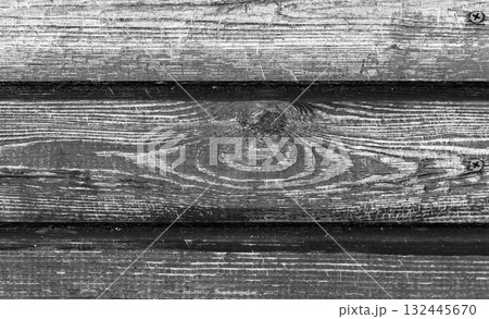 Detailed close-up view of old, weathered black wooden planks Detailed close-up view of old, weathered black wooden planks 132445670