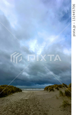 A Serene Beach Landscape Beneath a Dramatically Beautiful and Colorful Sky During Sunset 132445706