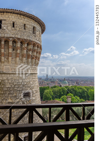 View from Brescia Castle drawbridge shows Prisoners Tower and cathedral dome in vertical city scene View from Brescia Castle drawbridge shows Prisoners Tower and cathedral dome in vertical city scene 132445783