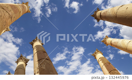 Roman Columns in the Jordanian city of Jerash (Gerasa of Antiquity), capital and largest city of Jerash Governorate, Jordan. Against the background of a beautiful sky with clouds 132445976
