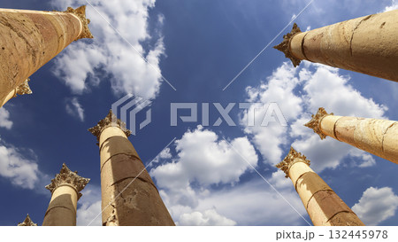 Roman Columns in the Jordanian city of Jerash (Gerasa of Antiquity), capital and largest city of Jerash Governorate, Jordan. Against the background of a beautiful sky with clouds Roman Columns in the Jordanian city of Jerash (Gerasa of Antiquity), capital and largest city of Jerash Governorate, Jordan. Against the background of a beautiful sky with clouds 132445978