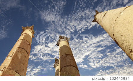 Roman Columns in the Jordanian city of Jerash (Gerasa of Antiquity), capital and largest city of Jerash Governorate, Jordan. Against the background of a beautiful sky with clouds Roman Columns in the Jordanian city of Jerash (Gerasa of Antiquity), capital and largest city of Jerash Governorate, Jordan. Against the background of a beautiful sky with clouds 132445984
