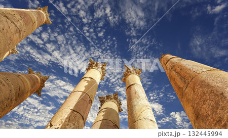 Roman Columns in the Jordanian city of Jerash (Gerasa of Antiquity), capital and largest city of Jerash Governorate, Jordan. Against the background of a beautiful sky with clouds Roman Columns in the Jordanian city of Jerash (Gerasa of Antiquity), capital and largest city of Jerash Governorate, Jordan. Against the background of a beautiful sky with clouds 132445994