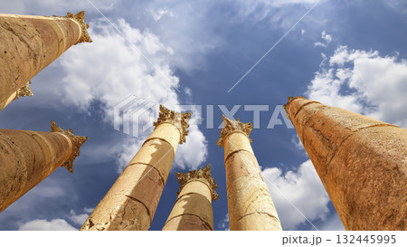 Roman Columns in the Jordanian city of Jerash (Gerasa of Antiquity), capital and largest city of Jerash Governorate, Jordan. Against the background of a beautiful sky with clouds 132445995