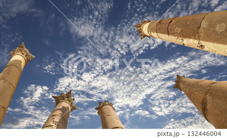 Roman Columns in the Jordanian city of Jerash (Gerasa of Antiquity), capital and largest city of Jerash Governorate, Jordan. Against the background of a beautiful sky with clouds 132446004
