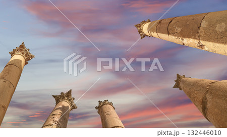 Roman Columns in the Jordanian city of Jerash (Gerasa of Antiquity), capital and largest city of Jerash Governorate, Jordan. Against the background of a beautiful sky with clouds 132446010
