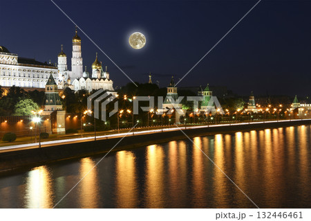 Night view of the Moskva River and Kremlin, Russia, Moscow (most popular view). Against the background of a beautiful sky with clouds, with the moon 132446461