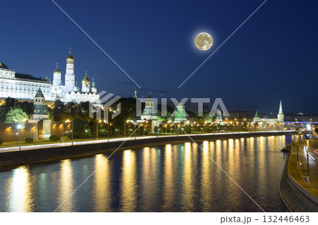 Night view of the Moskva River and Kremlin, Russia, Moscow (most popular view). Against the background of a beautiful sky with clouds, with the moon 132446463