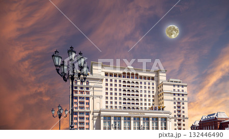 Facade of Four Seasons hotel (Hotel Moskva) from Manege Square on a beautiful sky with cloud before sunset background with the super moon. Moscow, Russia 132446490