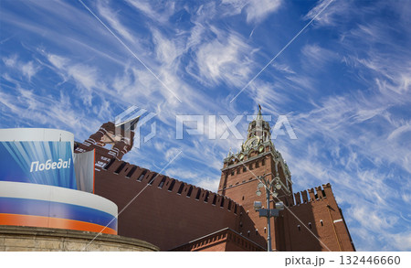 Moscow Kremlin (with decorations for the holiday of May 9 in honor of Victory Day celebration (WWII). Against the sky with clouds, Russia. TRANSLATION: Victory! Moscow Kremlin (with decorations for the holiday of May 9 in honor of Victory Day celebration (WWII). Against the sky with clouds, Russia. TRANSLATION: Victory! 132446660