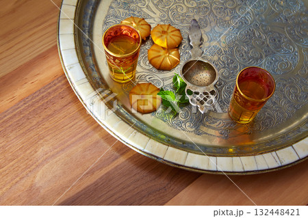 green tea with mint Moroccan style on silver tray green tea with mint Moroccan style on silver tray 132448421