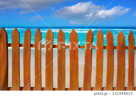 Caribbean island fence in turquoise beach 132448613