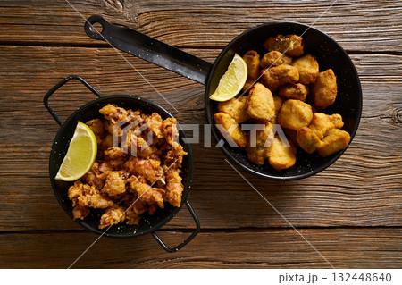 Tapas Adobo fried fish and puntilla skid breaded Tapas Adobo fried fish and puntilla skid breaded 132448640