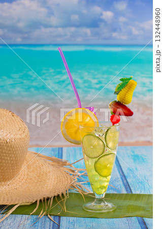 Lemon lime cocktail mojito on tropical beach Lemon lime cocktail mojito on tropical beach 132448960