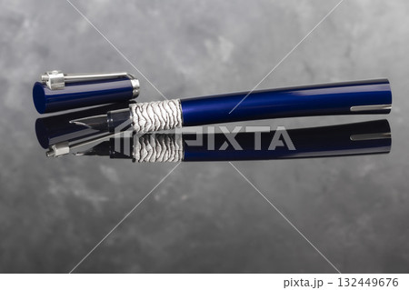 A signature fountain pen on a gray marble background. Gift set. Office decor. 132449676