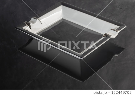 Large porcelain cigar ashtray on a marble background. Ash collector. Large porcelain cigar ashtray on a marble background. Ash collector. 132449703