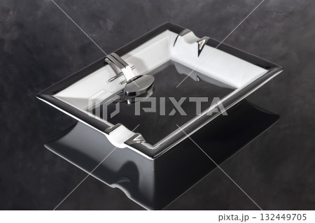 Large porcelain cigar ashtray on a marble background. Ash collector. Large porcelain cigar ashtray on a marble background. Ash collector. 132449705