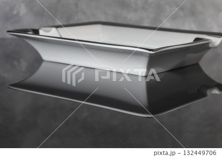 Large porcelain cigar ashtray on a marble background. Ash collector. Large porcelain cigar ashtray on a marble background. Ash collector. 132449706