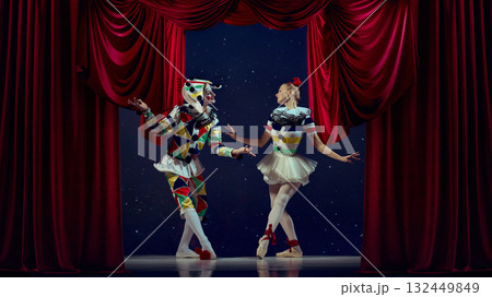 Holiday performance. Mime and ballerina dancing together on festive theater stage. 132449849