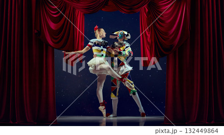 Stage harmony. Mime and ballerina dancing together under dramatic red curtains. 132449864