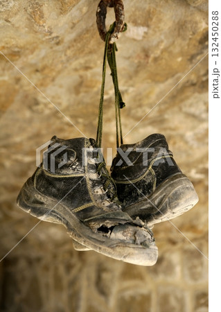 Construction worker left his aged old boots away Construction worker left his aged old boots away 132450288