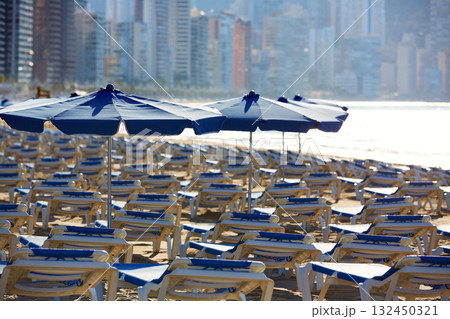 Benidorm sunrise with hammocks and parasol Benidorm sunrise with hammocks and parasol 132450321