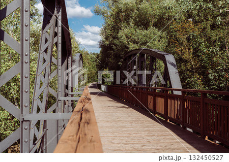 Cycle path leading across the post-war double-span truss bridge in Kamienna Gora, Lower Silesia, Poland. 132450527