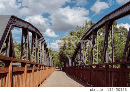 Cycle path leading across the post-war double-span truss bridge in Kamienna Gora, Lower Silesia, Poland. 132450528
