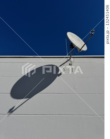 Satellite dish is mounted on a building 132451406