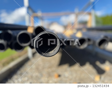 Bunch of pipes are stacked up in a pile Bunch of pipes are stacked up in a pile 132451434