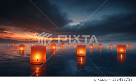 Ethereal Lanterns Illuminating Calm Water at Dusk Under a Dramatic Sky 132452758