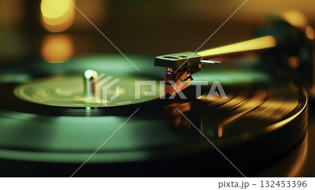 Close-up of Vintage Turntable with Stylus on Spinning Vinyl Record in Soft Light 132453396