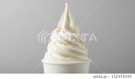 Delicious vanilla soft serve ice cream in cup against gray background 132454295