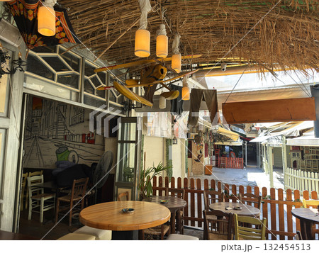 Outdoor cafe, favela, in Thessaloniki, Greece. Mainly visited by not rich locals, tourists rarely seen here. Thessaloniki, Greece 132454513
