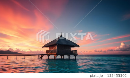 Sunset on a tropical beach with pier and ocean view at dusk. 132455302