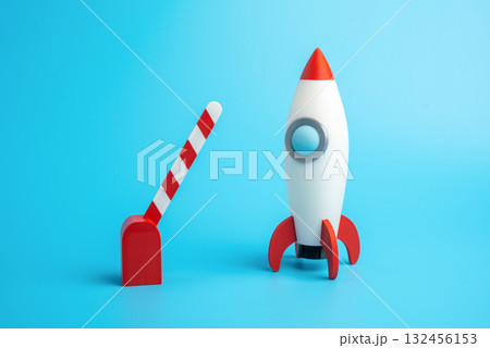 Rocket startup and open traffic barrier. Business launch permit. Investment or project financing. New beginnings, freedom to act, and investment approval. Startup innovation funding, entrepreneurship 132456153