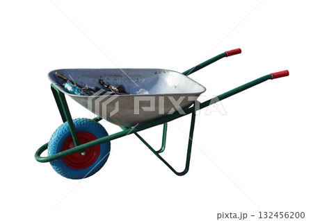 Wheelbarrow carrying dry branches and plastic bottle for recycling and gardening Wheelbarrow carrying dry branches and plastic bottle for recycling and gardening 132456200