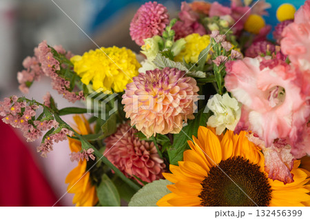 Vibrant mixed flower bouquet featuring sunflowers, dahlias, and carnations Vibrant mixed flower bouquet featuring sunflowers, dahlias, and carnations 132456399