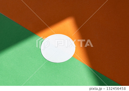 Abstract minimalist design with white circle on green and orange background Abstract minimalist design with white circle on green and orange background 132456458