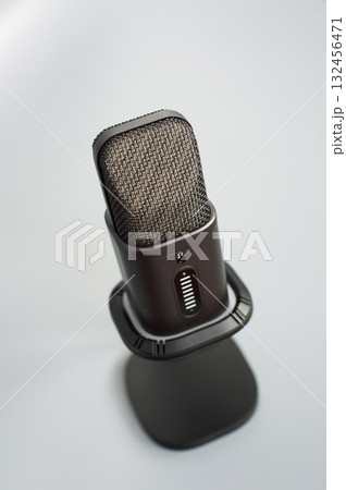 Close-up of modern black studio microphone on stand Close-up of modern black studio microphone on stand 132456471