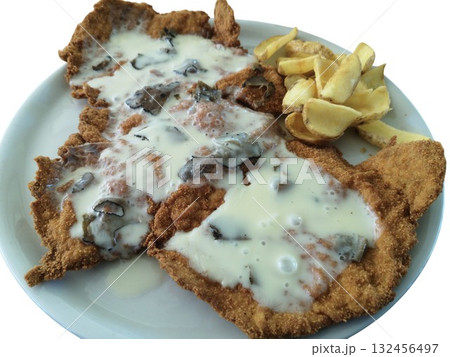 Breaded schnitzel cutlet with truffle cream sauce and fries Breaded schnitzel cutlet with truffle cream sauce and fries 132456497
