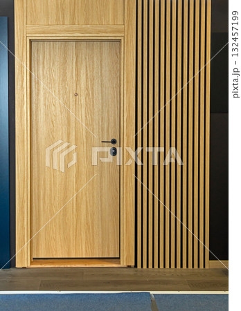 Brown door with wooden wall 132457199
