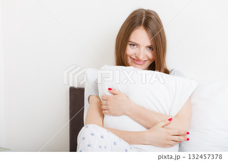 Tired girl hugging pillow. Tired girl hugging pillow. 132457378