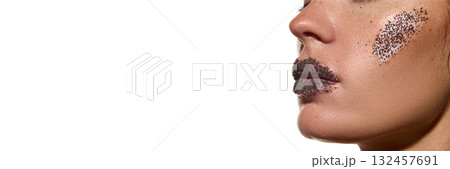 Side view woman with exfoliating cream and scrub on cheek and lips isolated on white. Banner 132457691