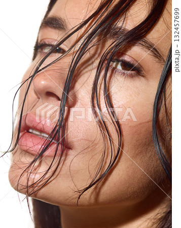Wet hair woman face with glossy skin and expressive look in light Wet hair woman face with glossy skin and expressive look in light 132457699