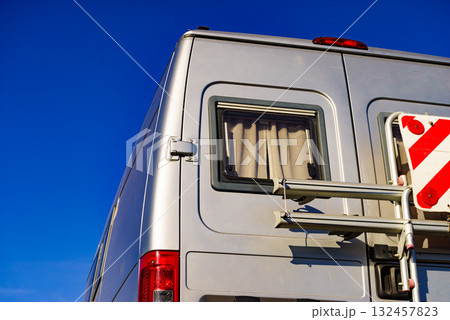 Car van with rack on back and rear warning sign for safety 132457823